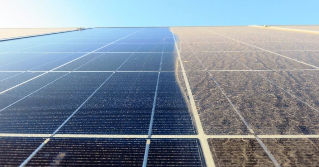 A contrast between clean solar panels on the left, and dirty solar panels on the right that need cleaning