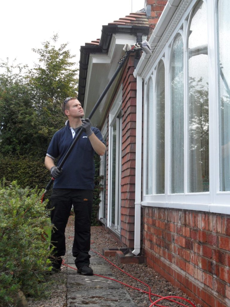 Cleaning conservatory windows with a water fed pole and pure water