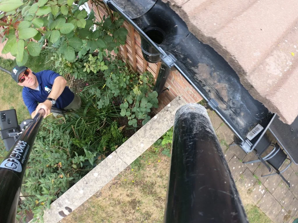 High-reach gutter vacuum equipment used for gutter clearance